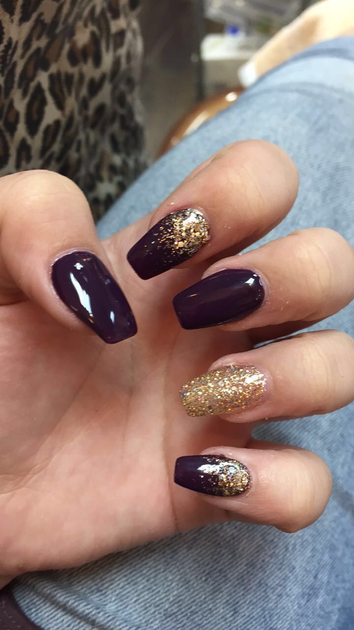 Sophisticated Deep Purple Nail Design with Shimmering Gold Accents for Glamorous Occasions.