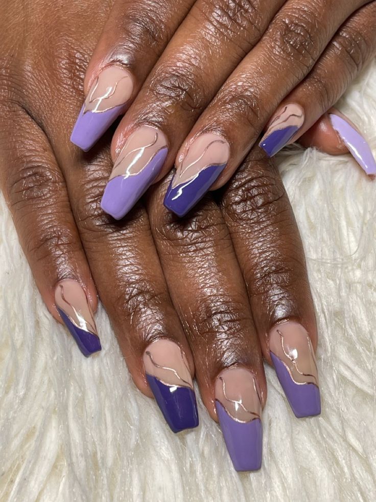 Chic Purple and Nude Nail Design with Glossy Finish and Artistic Wave Pattern.