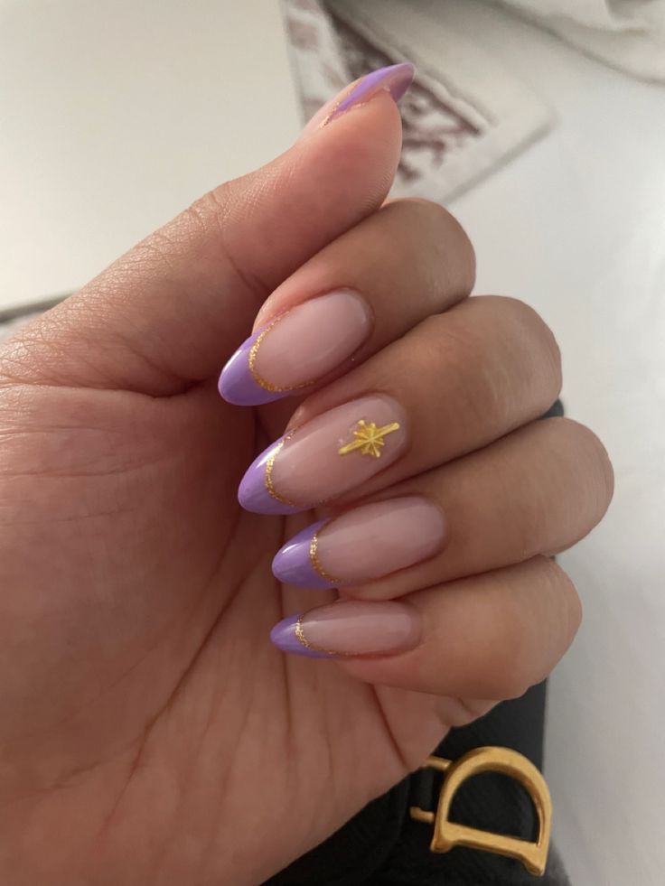 Chic Almond-Shaped Nails with Lavender French Tips and Gold Accents.