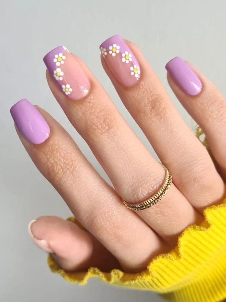 Spring-Inspired Lavender Nail Design with Delicate Daisy Accents and Elegant Gold Accessories.