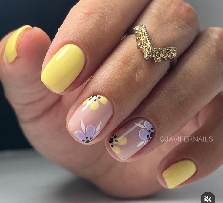 Cheerful Bright Yellow Nail Design with Playful Floral Artwork