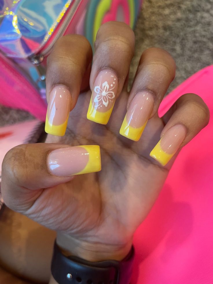 Playful Pastel Pink and Bright Yellow Nail Design with Whimsical Flower Accent.