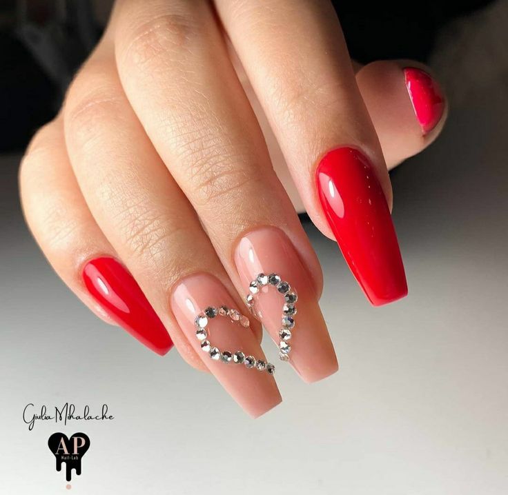 Chic Heart-Shaped Nail Design with Bold Red, Soft Nude, and Sparkling Rhinestones