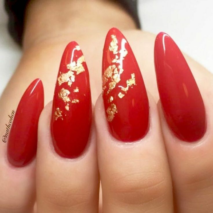 Bold Red Almond-Shaped Nails with Glamorous Gold Leaf Accents