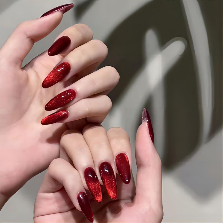 Sophisticated Elegant Red Nail Design with Stunning Gradient and Glitter Accents.