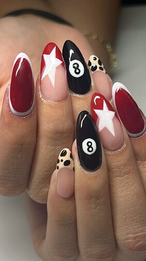 Vibrant Nail Design with Red, Black, and Neutral Tones Featuring Star Motifs and Polka Dots