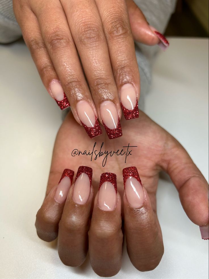 Elegant French Tip Nail Design with Striking Red Glitter Finish.