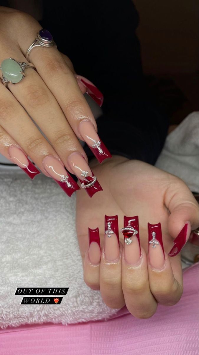 Chic Red-Tipped Nail Design with Glamorous Embellishments