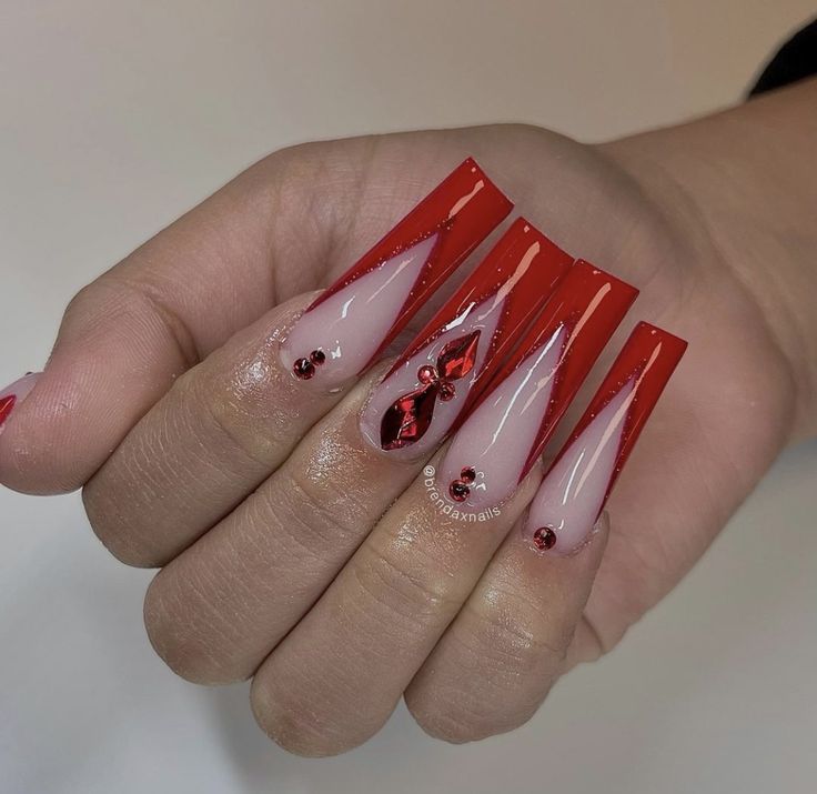 Captivating Red and Nude Ombre Stiletto Nails: A Bold and Elegant Statement.