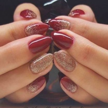 Chic Burgundy and Gold Almond-Shaped Nail Design for Sophisticated Occasions.