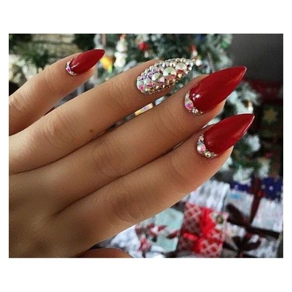 Glamorous Stiletto Red Nails with Rhinestones and Festive Accent Design