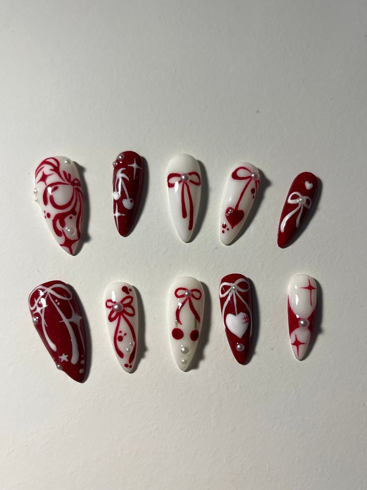 Chic Festive Nail Art: Red and White Elegance with Ribbons, Bows, and Pearls