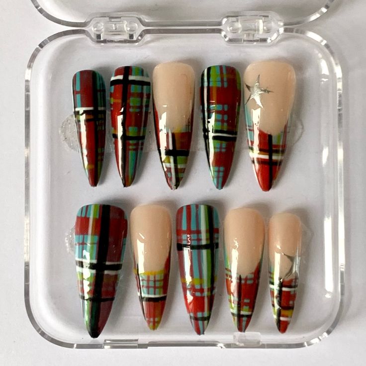 Chic Plaid Nail Set: Vibrant Red, Green, and Blue with Pointed and Nude Accents.