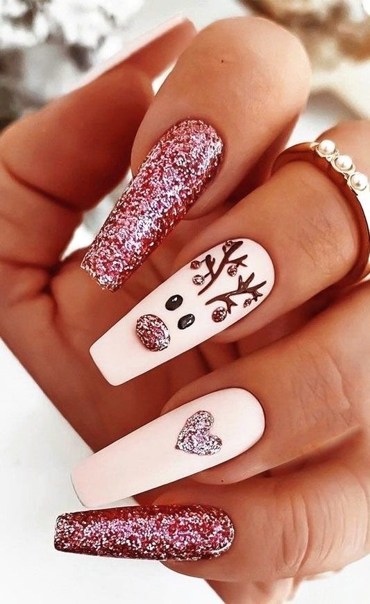 Chic Glittery Nail Design: Soft Pink and Rose Gold with Floral Patterns and Accents.