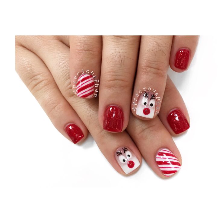 Whimsical Holiday Nail Design with Sparkling Red Polish and Adorable Accents.