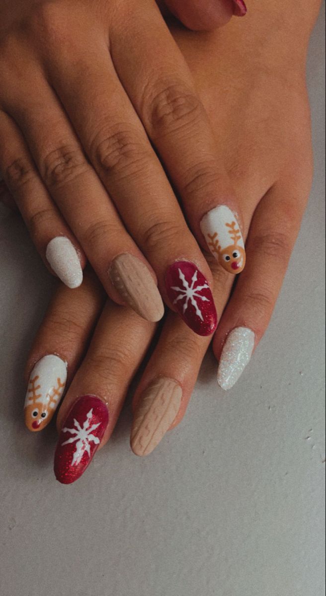 Cheerful Holiday Nail Design with Festive Motifs and Shimmering Accents