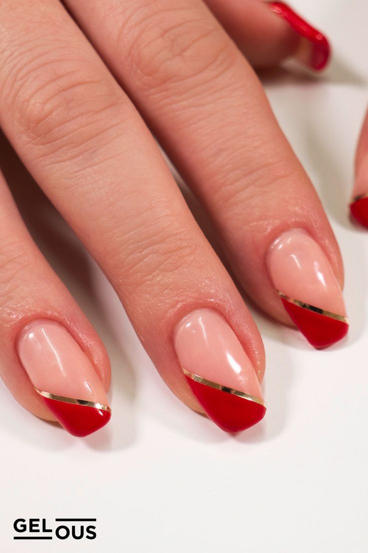 Elegant Chic Nail Design: Nude Base with Bold Red Tips and Gold Striping.