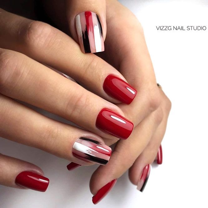 Chic Nail Design: Striking Red and Pastel with Abstract Accent.