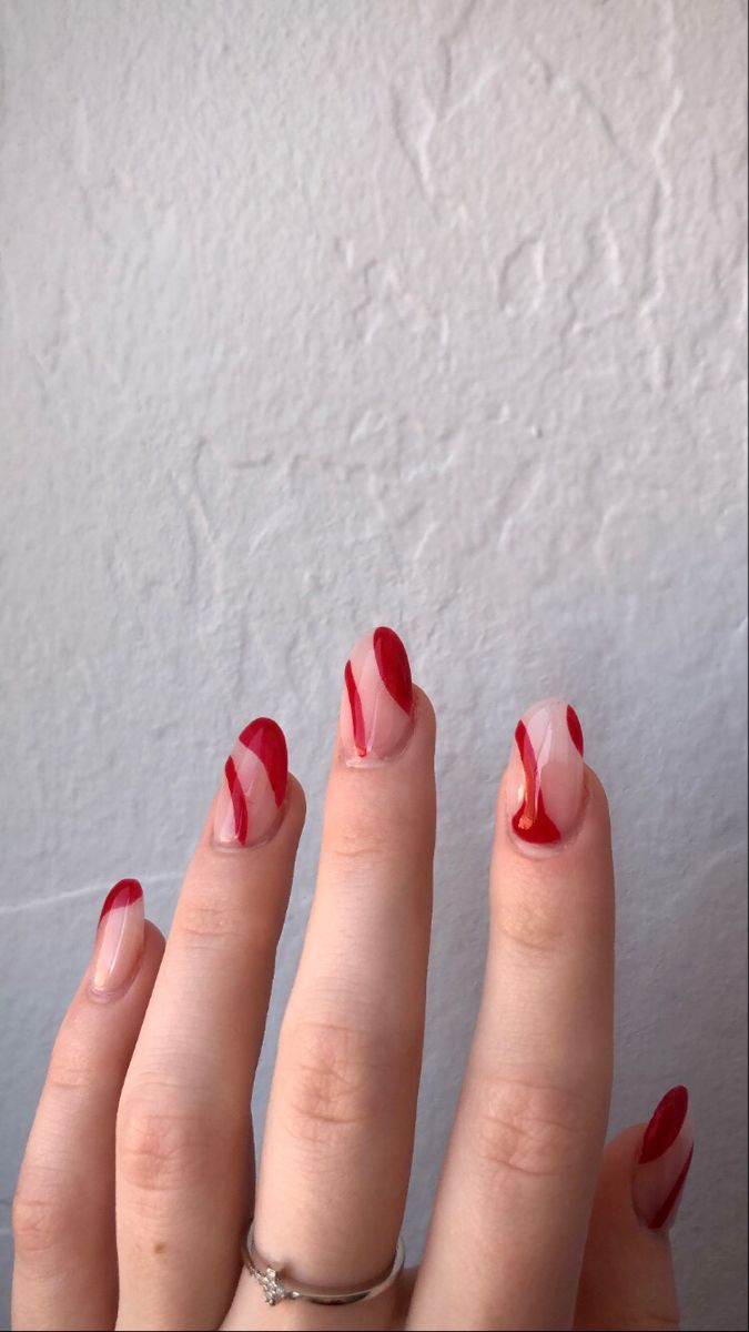 Elegant Nail Design: Modern Twist on Classic French Tips with Translucent and Deep Red Shades.