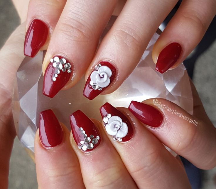 Stunning Elegant Red Floral Nails with Rhinestones for Special Occasions.