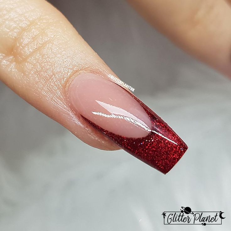 Elegant Deep Red Glitter Gradient Nail Design with Sophisticated White Accent.