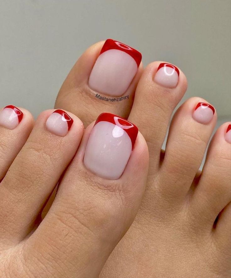 Elegant Red-Tipped French Pedicure: A Modern Summer Statement.