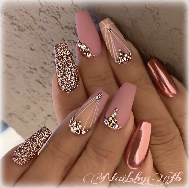 Chic Pink and Rose Gold Nail Design with Glitter and Rhinestones for Special Occasions.