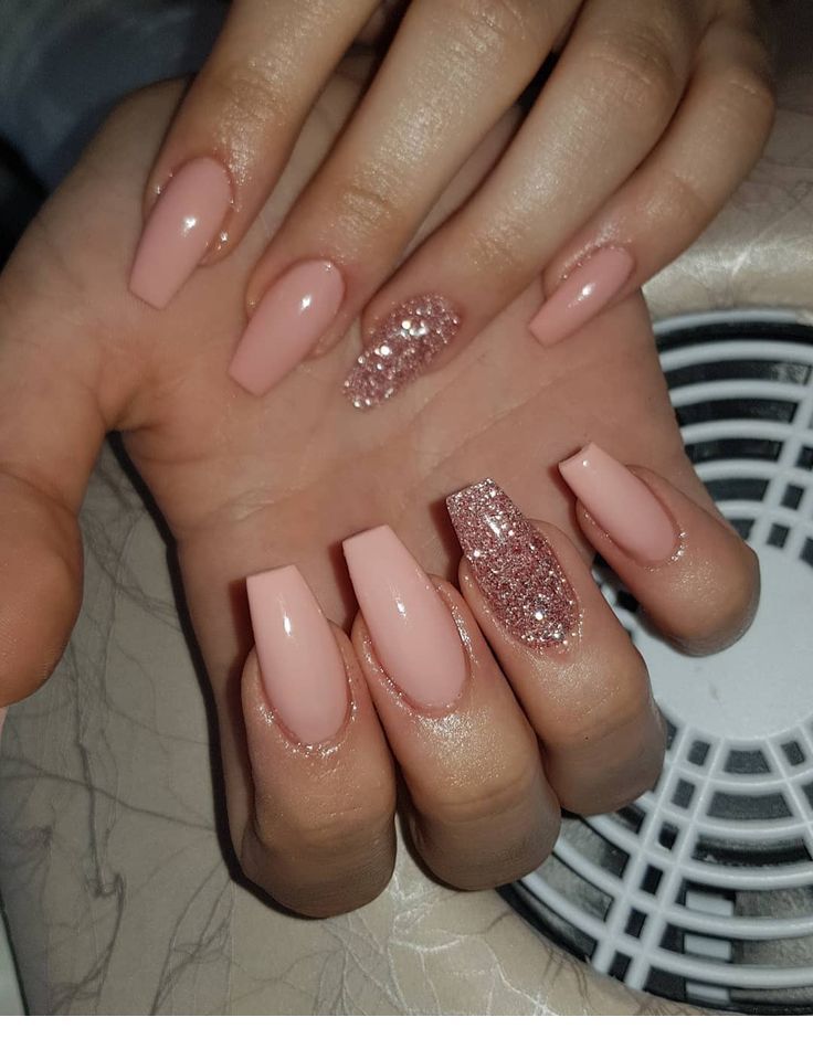 Chic Soft Pink Nail Design with Glitter Accents for a Polished Look.