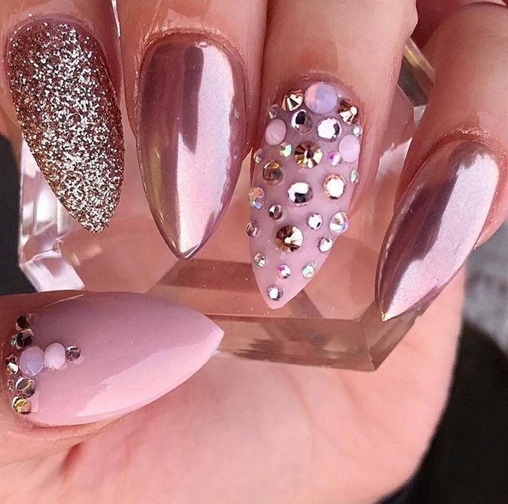 Sleek Almond-Shaped Nail Design with Metallic, Pastel, Glitter, and Gem Accents