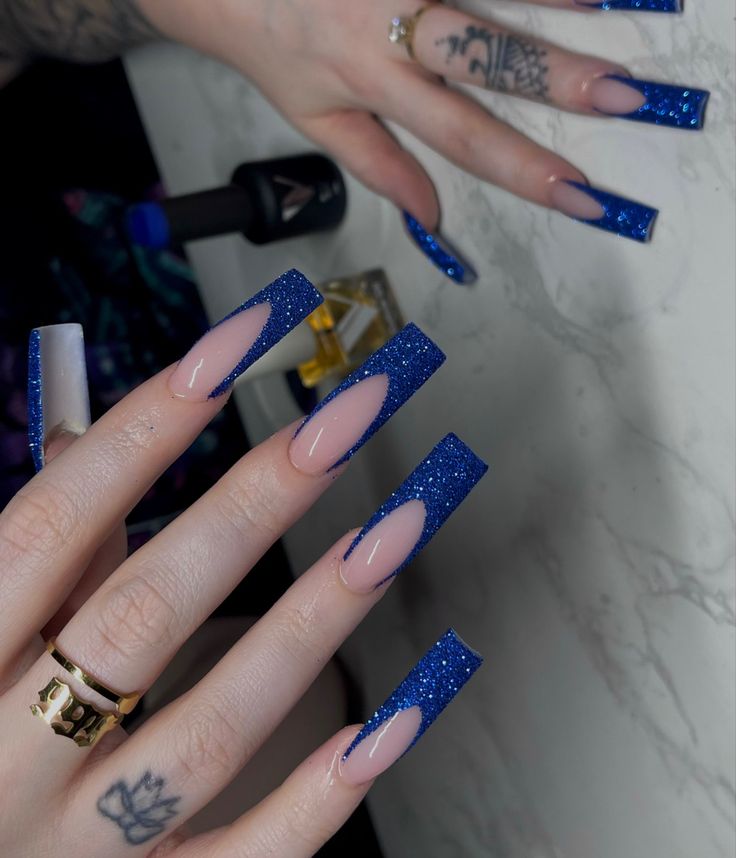 Elegant Blue Glitter Nail Art: Striking Contrast for Glamorous Looks.