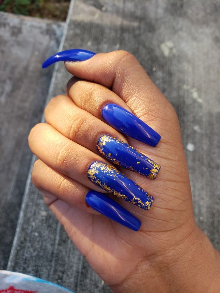 Chic Bold Blue Nails with Glossy Finish and Elegant Gold Accent.