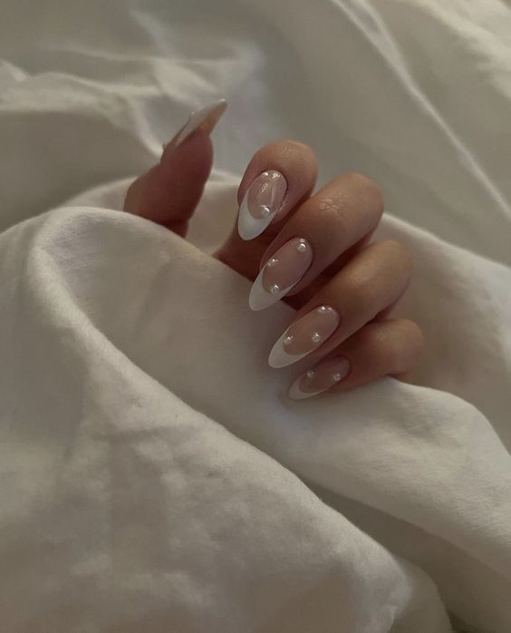 Sophisticated Modern French Tip Nail Design with Clear Embellishments.