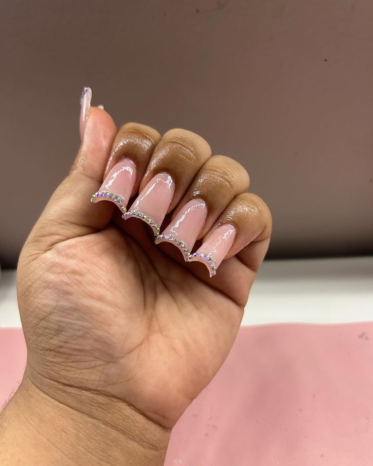 Elegant Almond-Shaped Nails with Soft Pink Base and Shimmering Silver Tips