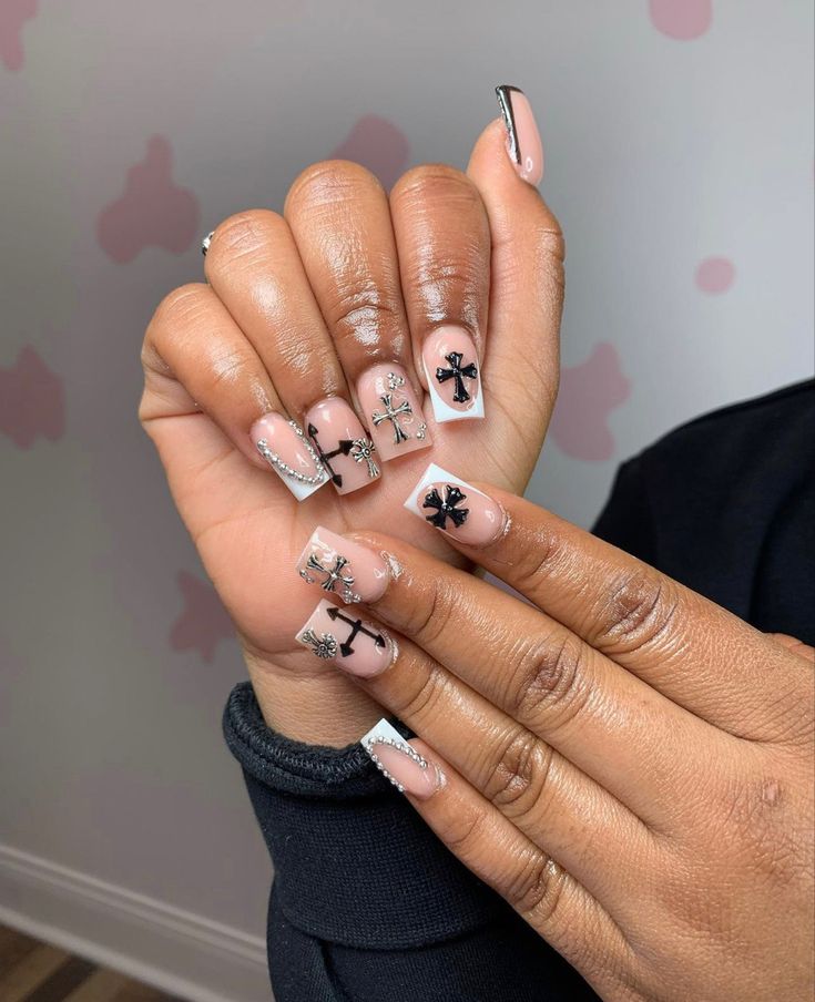 Chic Nail Design: Nude and Clear Tips with Intricate Black Floral Patterns and Sparkling Silver Accents