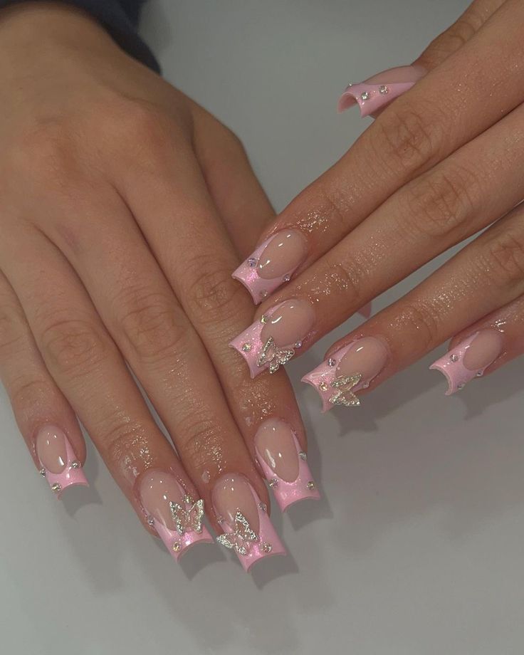 Whimsical Soft Pink Nail Design with Glossy Finish and Butterfly Accents