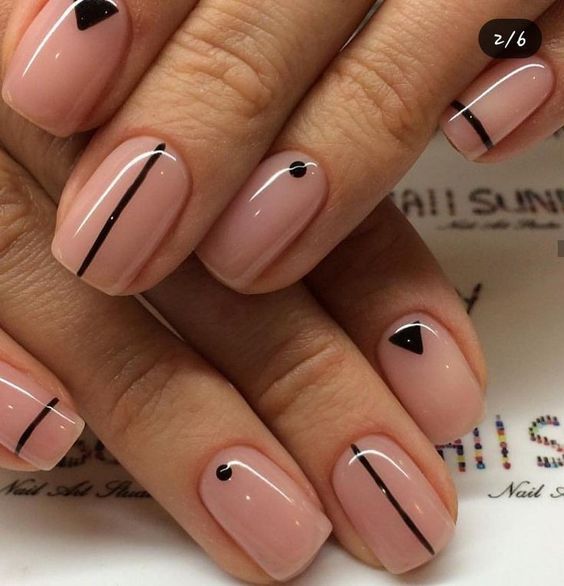 Chic Nail Design: Soft Nude Base with Bold Black Geometric Accents