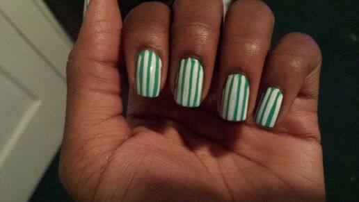 Chic Green and White Striped Nail Design for a Fresh Look.