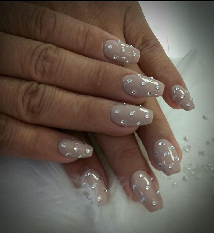 Sophisticated Nude Nail Design with Shimmering Rhinestones for Any Occasion.