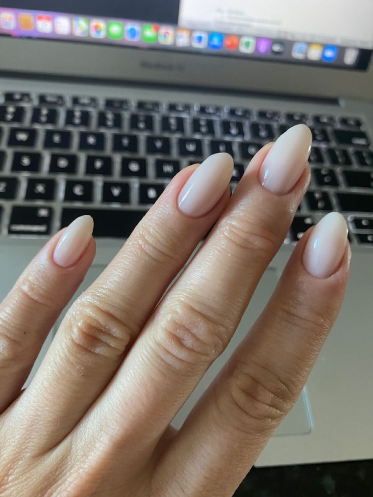 Sophisticated Almond-Shaped Nude Nails: Timeless Elegance for Any Occasion