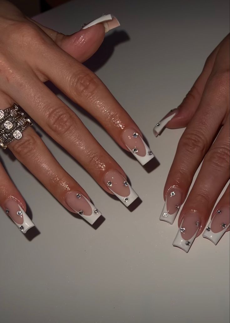 Sophisticated Long Sculpted French Manicure with Rhinestone Accents.