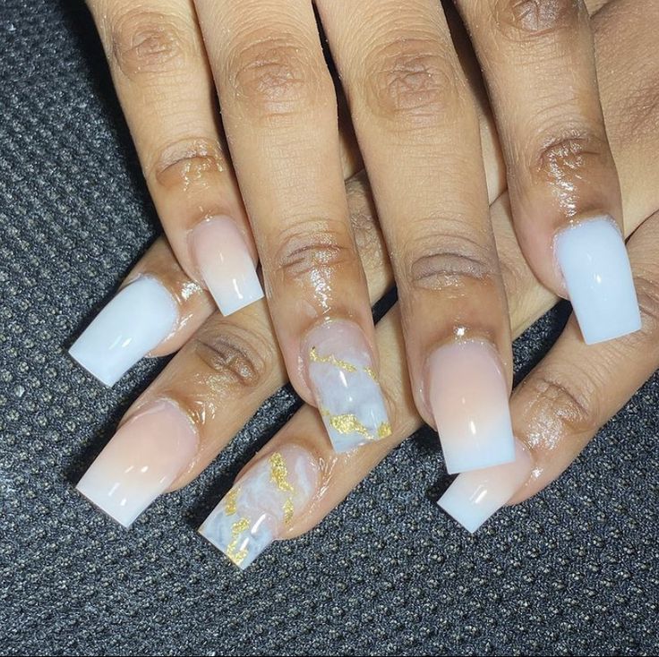 Sophisticated Pastel Ombre Nail Design with Marbled Accents and Gold Foil Details.