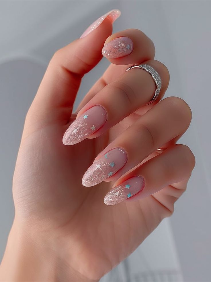 Chic Nail Design: Subtle Pink Gradient with Sparkling Tips and Playful Star Embellishments