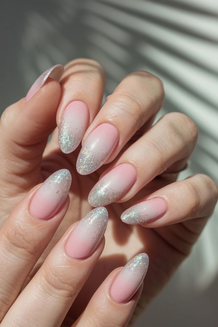 Sophisticated Ombre Nails with Soft Pink Base and Sparkling Tips.