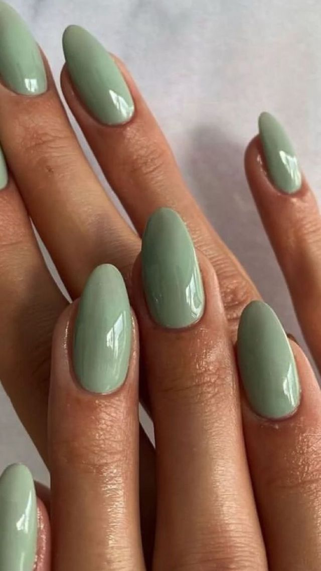 Chic Matte Green Almond-Shaped Nails for a Modern, Minimalist Look.