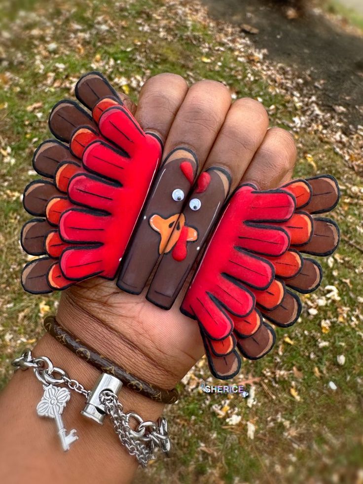 Whimsical Thanksgiving Nail Art with Multi-Colored Turkey Feather Patterns.