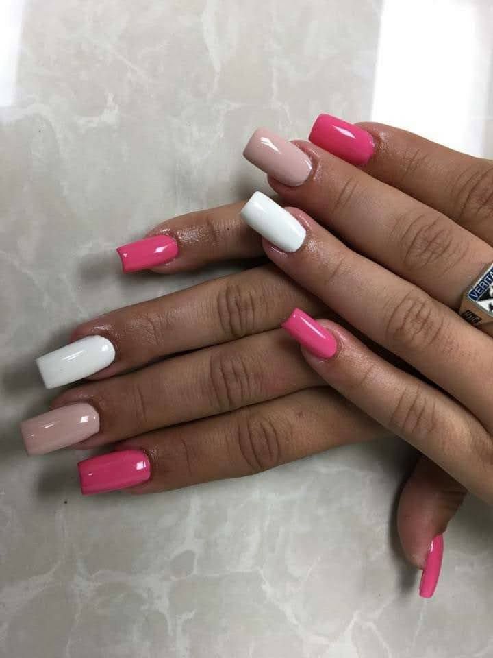 Playful Pink and White Nail Design: A Trendy Modern Manicure.