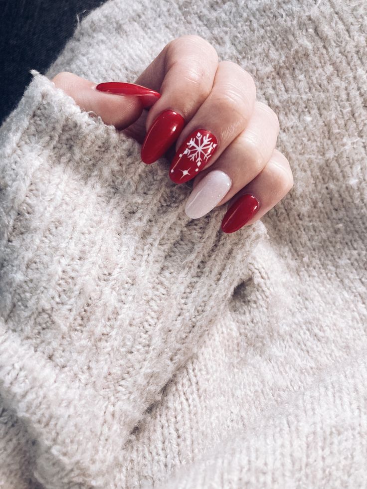 Elegant Winter-Themed Festive Nail Design with Striking Red, Soft White, and Intricate Snowflake Details.