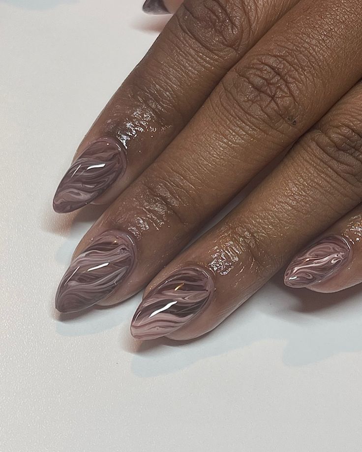 Sophisticated Marble Nail Design in Mauve and Pink with Glossy Finish