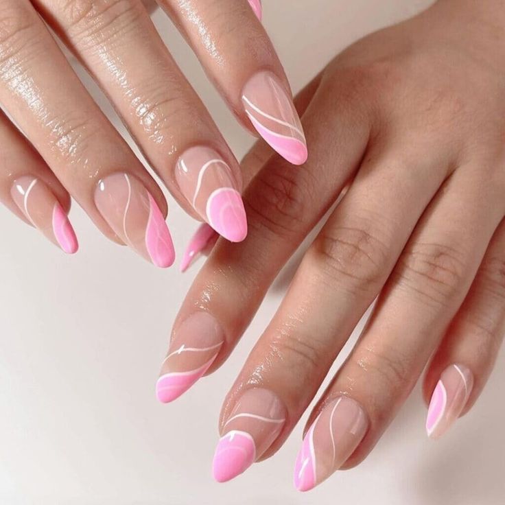 Sophisticated Almond Nail Design with Soft Pink Gradient and Delicate White Swirls.