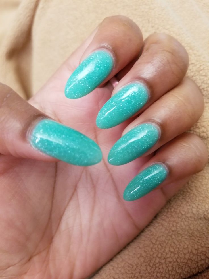 Chic Glistening Turquoise Nails: A Playful Splash of Color with Sparkling Texture.